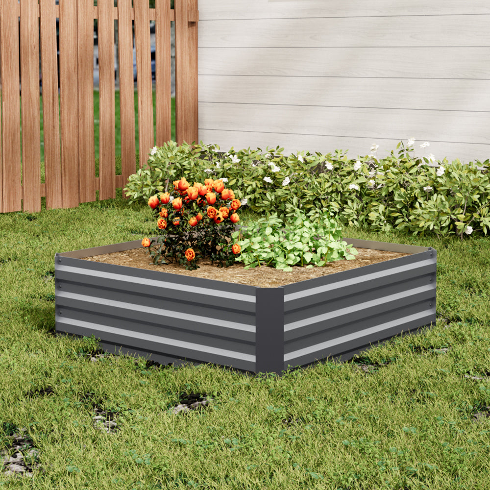 Small Grey Galvanized Steel Square Raised Garden Bed in an outdoor garden with vibrant plants and flowers
