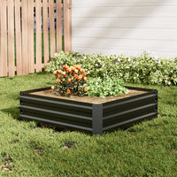 Wide shot of Medium Black Galvanized Steel Square Raised Garden Bed in a well-maintained backyard garden