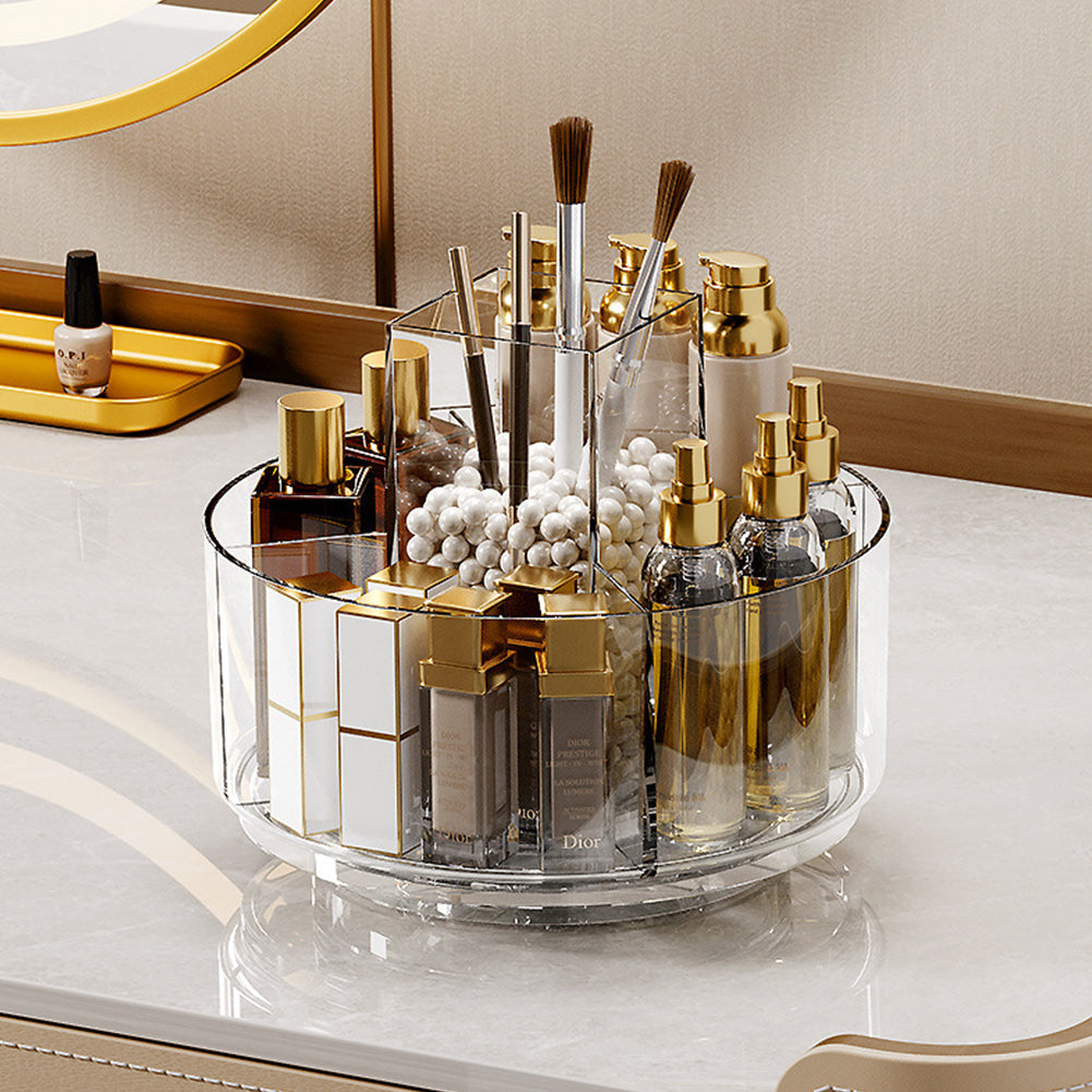 Clear makeup carousel organizer with brush holders and stocked beauty bottles