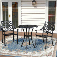 Poinciana Hollow Metal Round Patio Table Set Up in Garden – Outdoor Dining Area