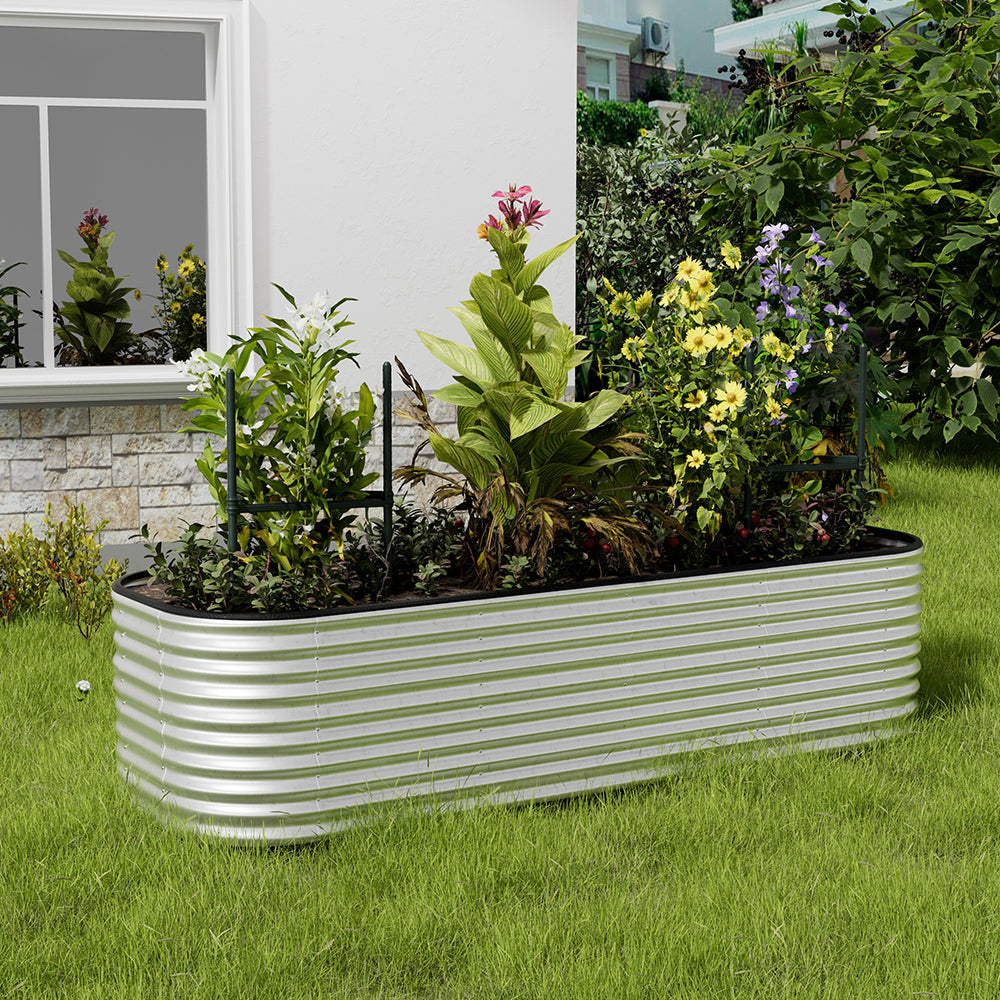 Galvanized silver oval-shaped raised garden bed in backyard garden – perfect for growing plants and herbs outdoors