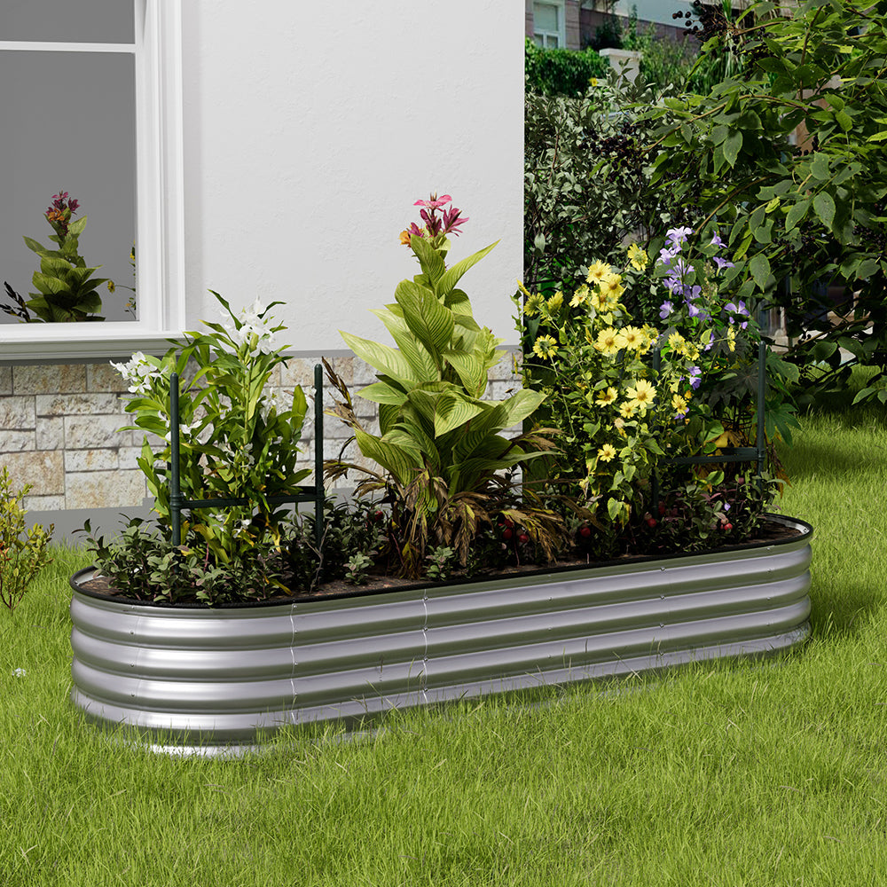 Galvanized silver oval raised garden bed in garden setting – perfect for planting vegetables and flowers