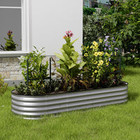 Galvanized silver oval raised garden bed in garden setting – perfect for planting vegetables and flowers