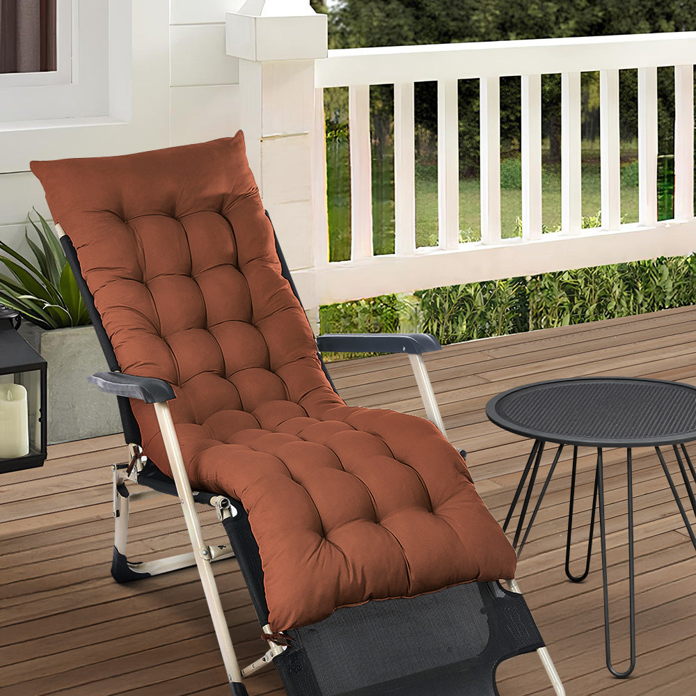 Coffee Outdoor Seat Cushion placed on patio chairs in a garden, perfect for relaxing and enjoying outdoor spaces