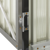 close-up of reinforced lower door panel on grey bike storage shed for added durability