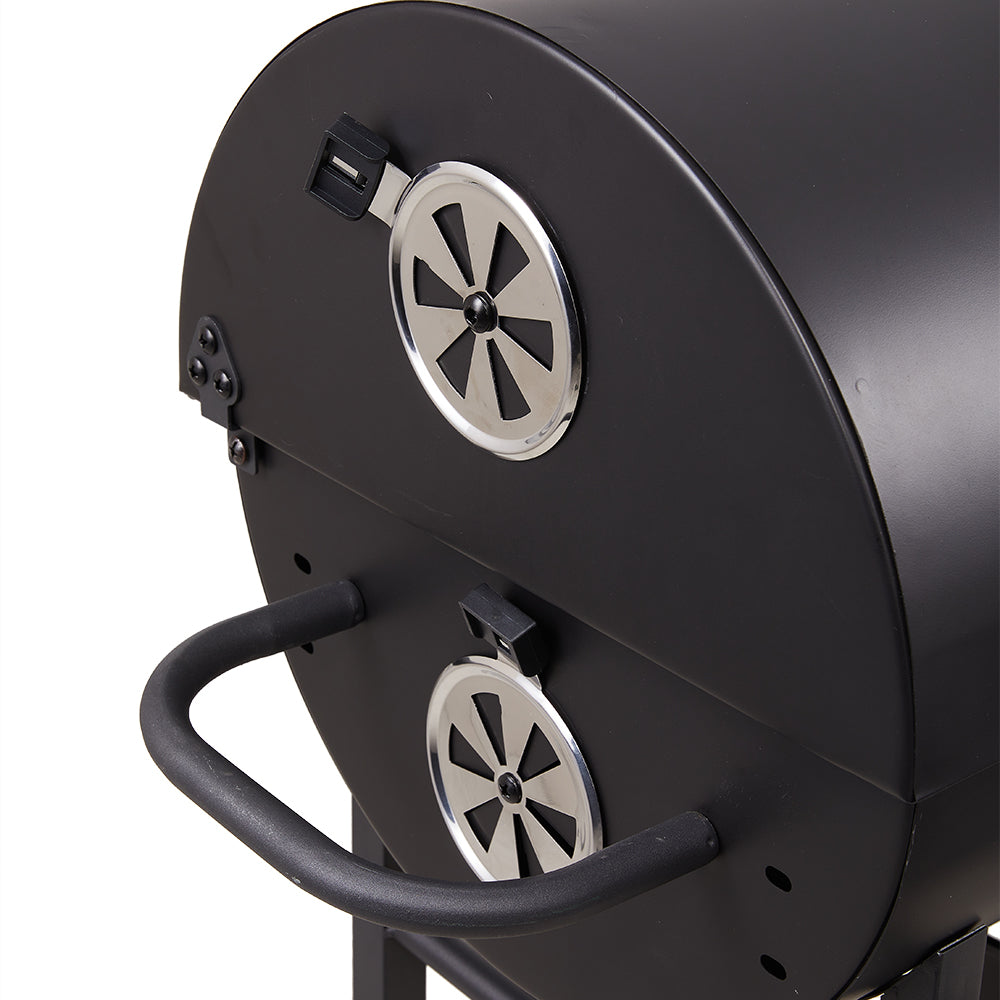 Detail of dual cooking panels and air vent system on portable barrel charcoal BBQ grill – adjustable for even heat distribution
