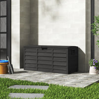 Black 290L outdoor deck box positioned near wall – garden storage for tools, toys, or cushions