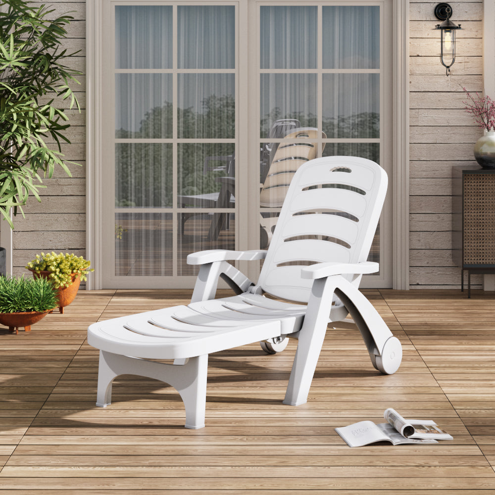 White plastic lounger recliner by poolside – perfect for garden, patio, or poolside lounging