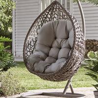 Thick Hanging Egg Swing Cushion in a cozy outdoor garden, adding comfort and style to your swing