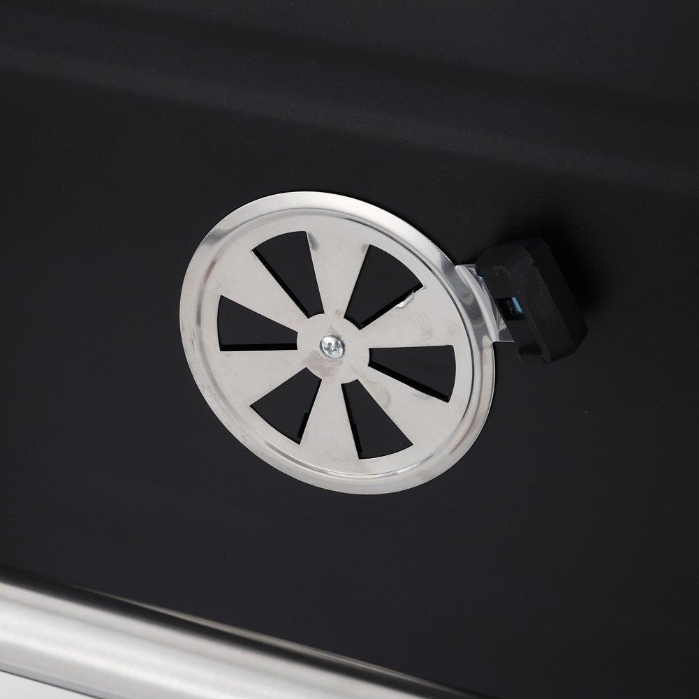 adjustable air vent on side of charcoal grill – ensures efficient heat and smoke control