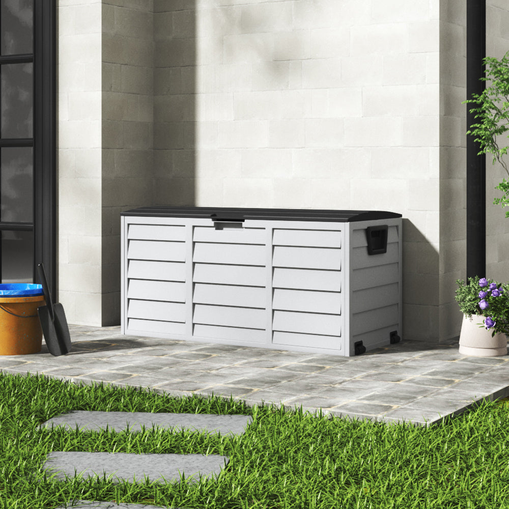Dark grey and light grey 290L storage deck box in patio setting – secure and waterproof design