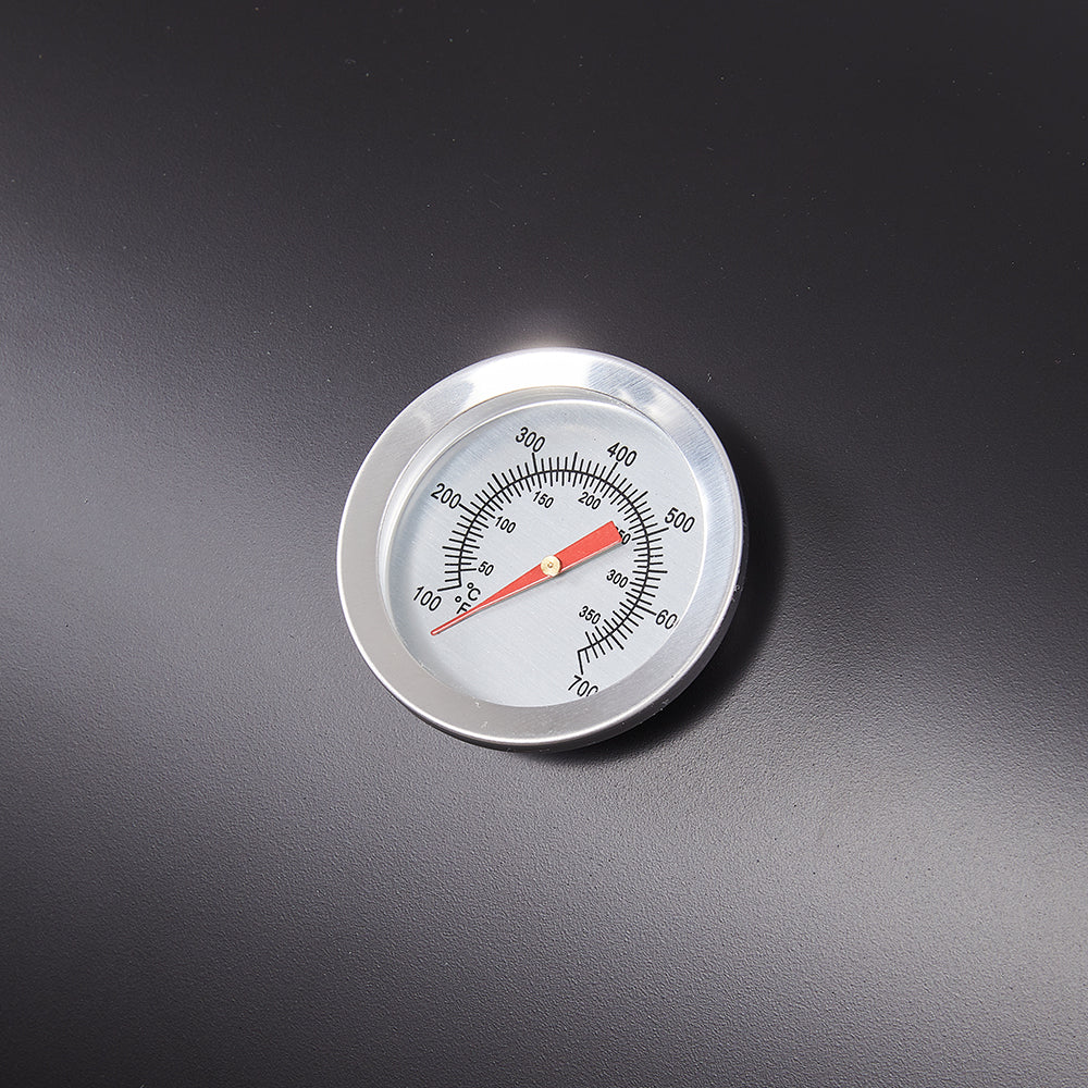 Close-up of built-in thermometer on barrel charcoal BBQ grill lid – precise heat control for outdoor cooking