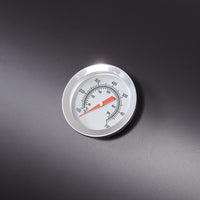 Close-up of built-in thermometer on barrel charcoal BBQ grill lid – precise heat control for outdoor cooking