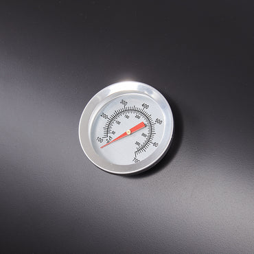 Close-up of built-in thermometer on barrel charcoal BBQ grill lid – precise heat control for outdoor cooking