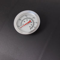 Close-up detail of charcoal BBQ grill smoker lid with handle and chimney – portable barrel design for outdoor grilling