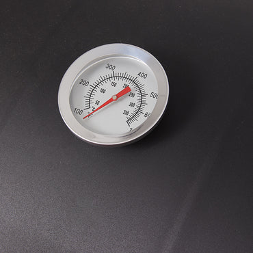 Close-up detail of charcoal BBQ grill smoker lid with handle and chimney – portable barrel design for outdoor grilling