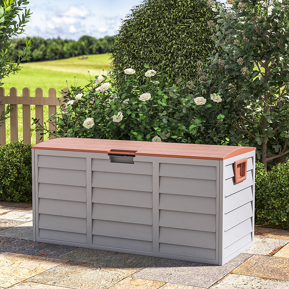 brown garden storage box with wheels – closed and placed against garden wall, perfect for patio storage