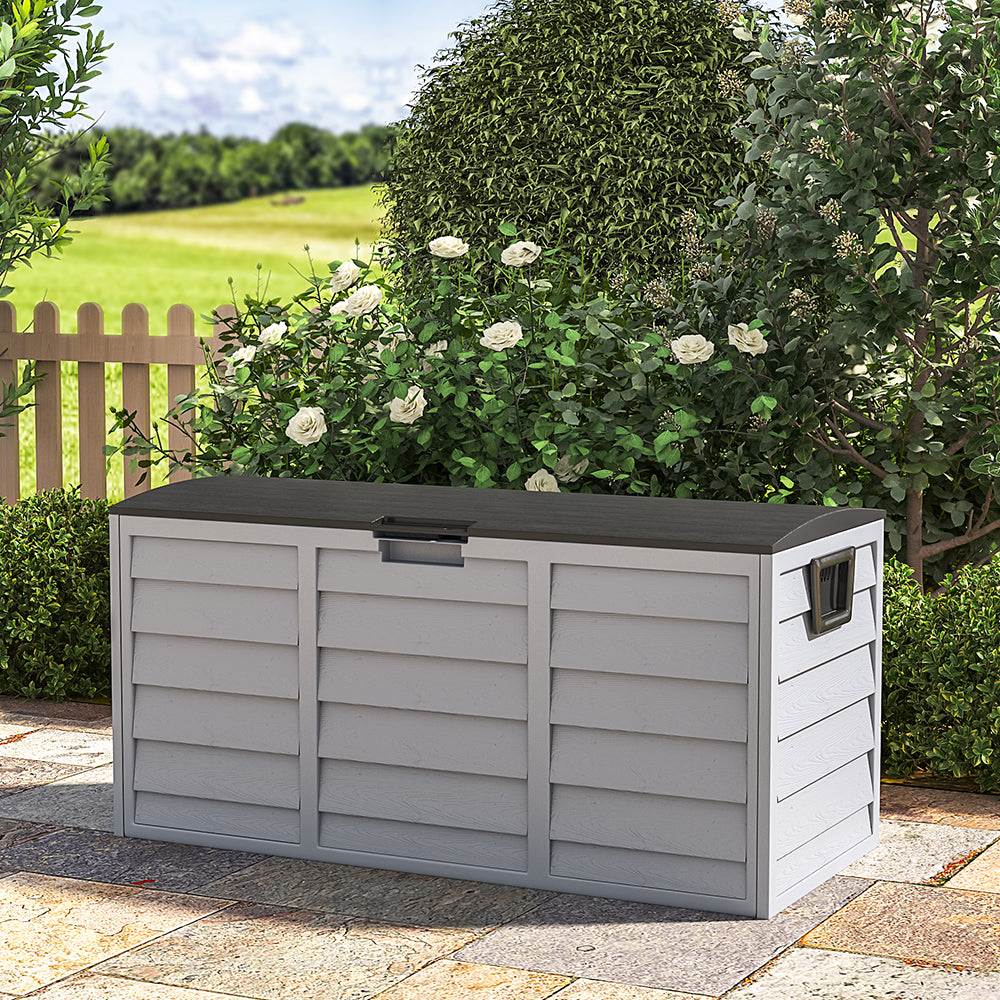 black garden storage box with wheels – placed closed against patio wall, ideal for outdoor use