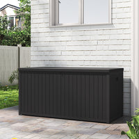 Weatherproof Black 430L Storage Box Against Patio Wall – Ideal for Garden Use