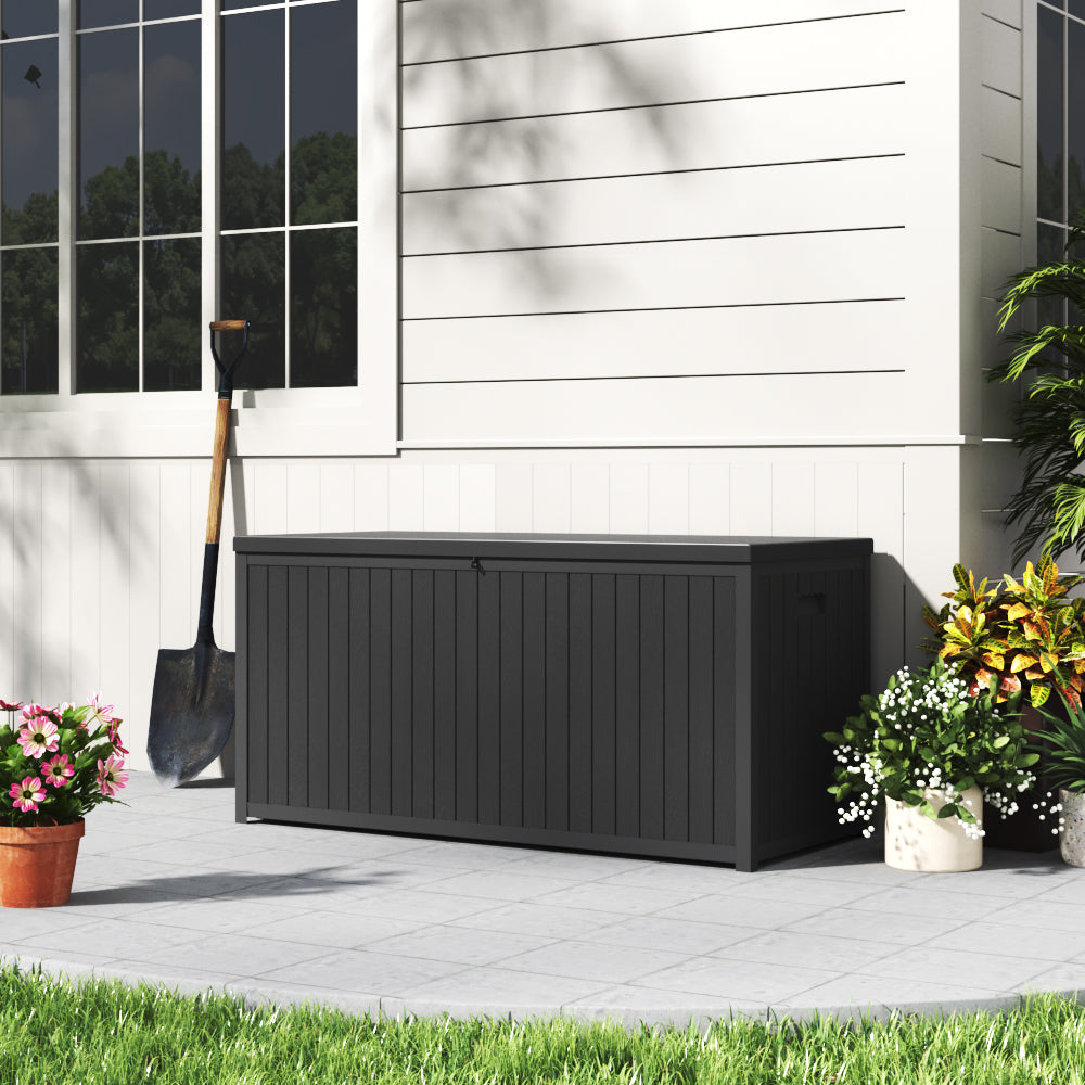 Closed Black 430L Lockable Storage Box by Garden Wall – Stylish Outdoor Storage Solution