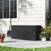 Closed Black 430L Lockable Storage Box by Garden Wall – Stylish Outdoor Storage Solution