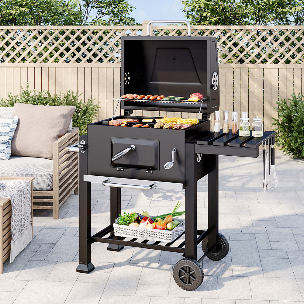 outdoor charcoal grill with smoker in garden setting – ideal for summer cookouts and grilling parties
