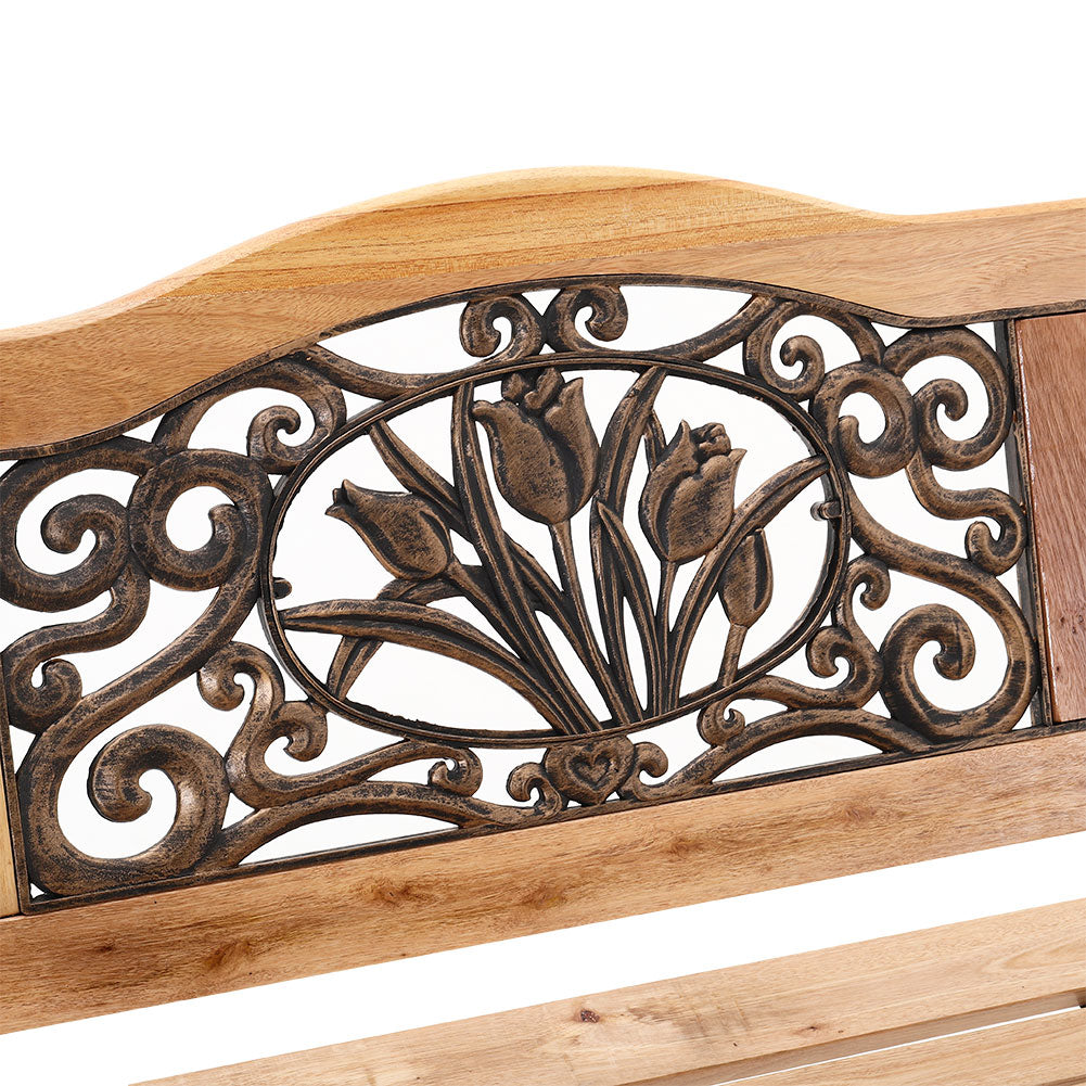 Close-Up of Decorative Scroll Backrest Design on Cast Iron Garden Bench