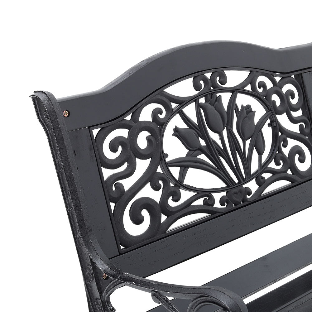 Close-up of Decorative Metal Backrest Design on Black Garden Bench