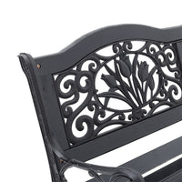 Close-up of Decorative Metal Backrest Design on Black Garden Bench