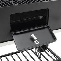 Close-up of air vent on barrel charcoal BBQ grill – adjustable damper for smoke and heat control