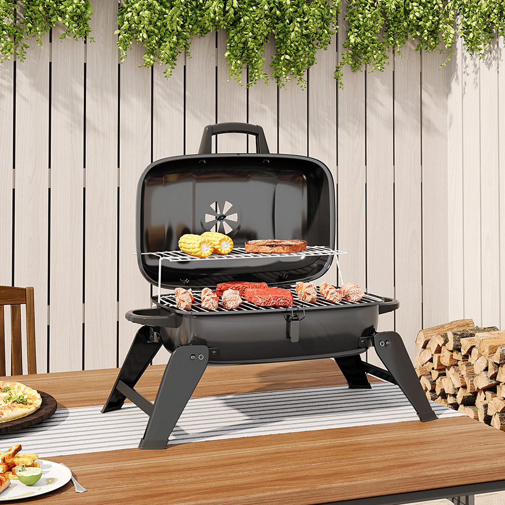Tabletop Charcoal BBQ Grill in Use – Perfect for Garden Barbecues and Outdoor Picnics