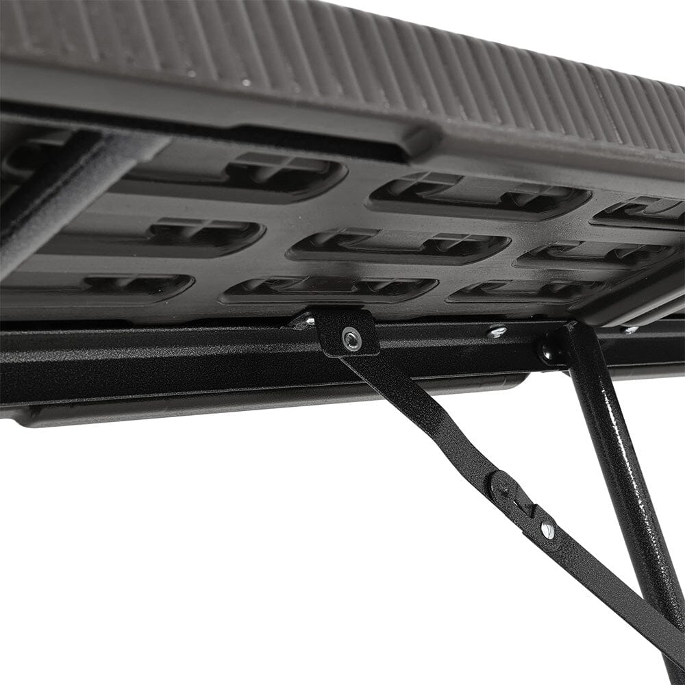 Underside View of Black Rattan Folding Chair – Sturdy Frame and Leg Structure