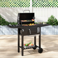 Outdoor black charcoal barbecue grill with smoke stack and dual shelves, 109cm x 33cm x 106.5cm – perfect for garden or patio cooking
