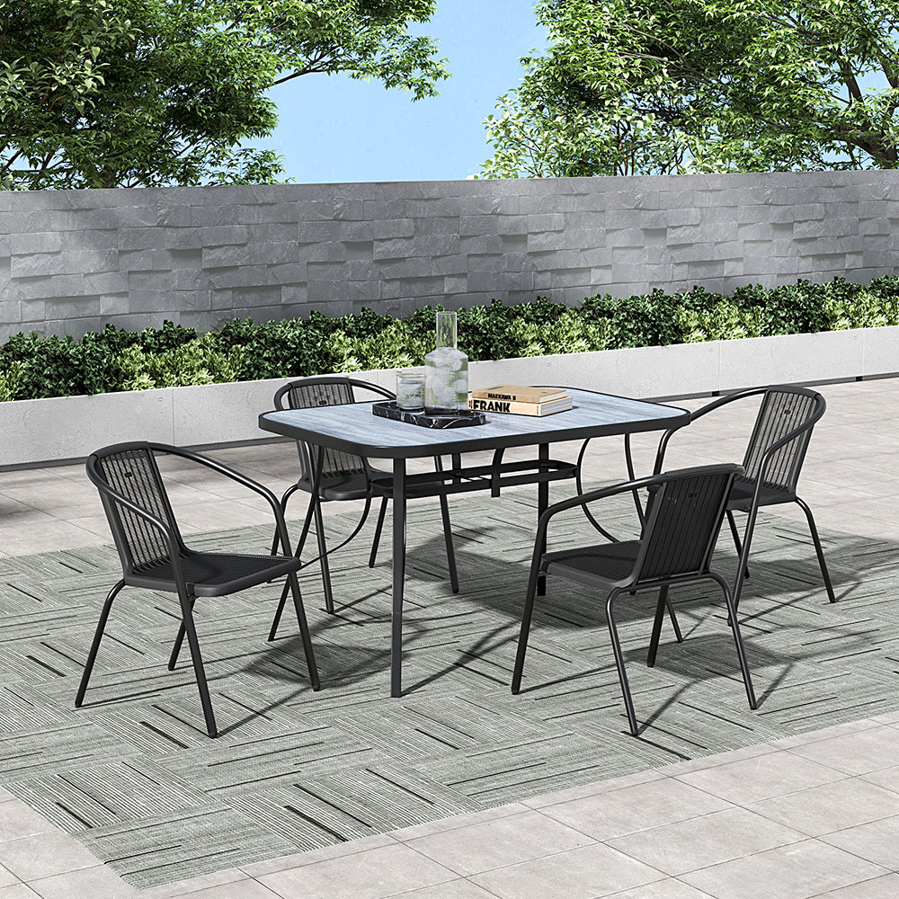 Large black rectangular patio table in garden setup – 122 x 82 cm glass tabletop