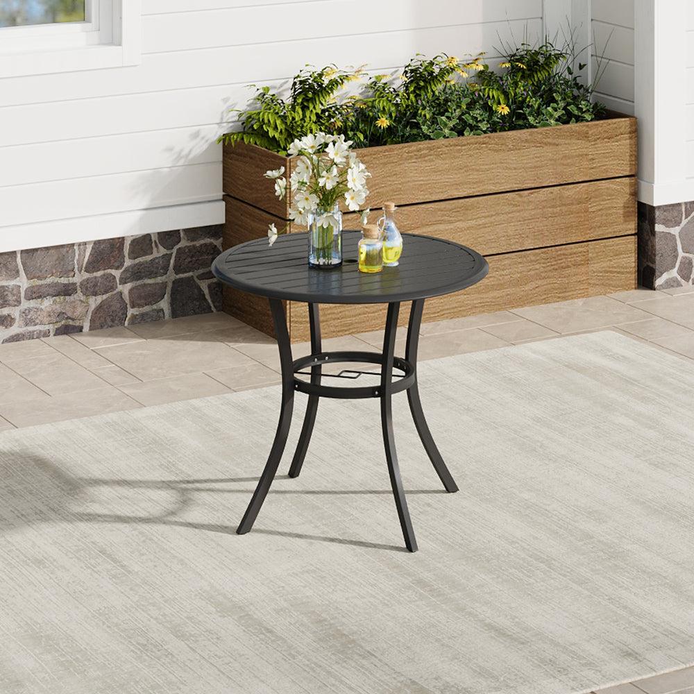 Round metal slatted garden table on patio with two chairs – perfect for outdoor dining or coffee