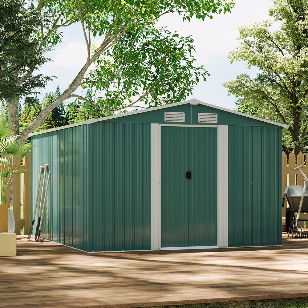 Spacious green metal shed in home garden used for outdoor storage