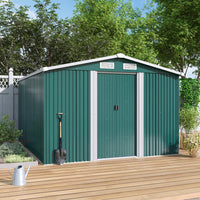 10x8ft green shed placed in a garden corner with plants around