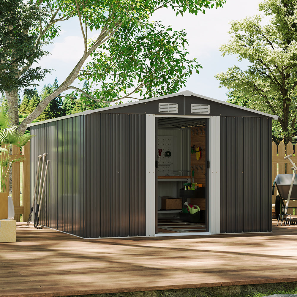 Metal storage shed with open door, surrounded by trees and wooden deck