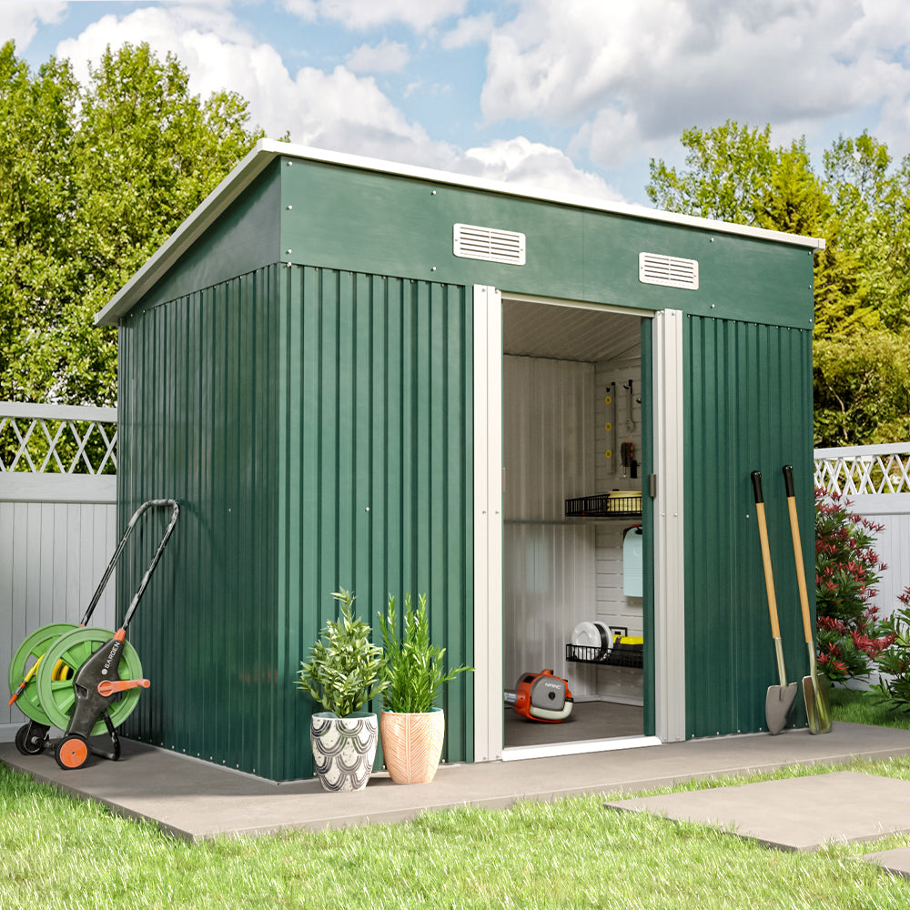 open green metal garden shed with tools inside, placed on deck in backyard