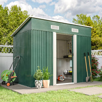 open green metal garden shed with tools inside, placed on deck in backyard