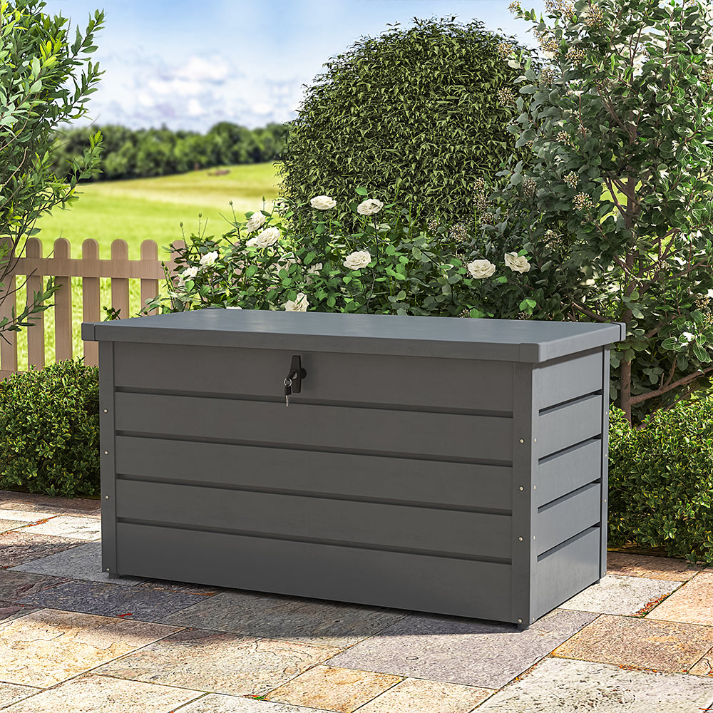 charcoal black steel garden storage box – closed and placed in patio or garden setting