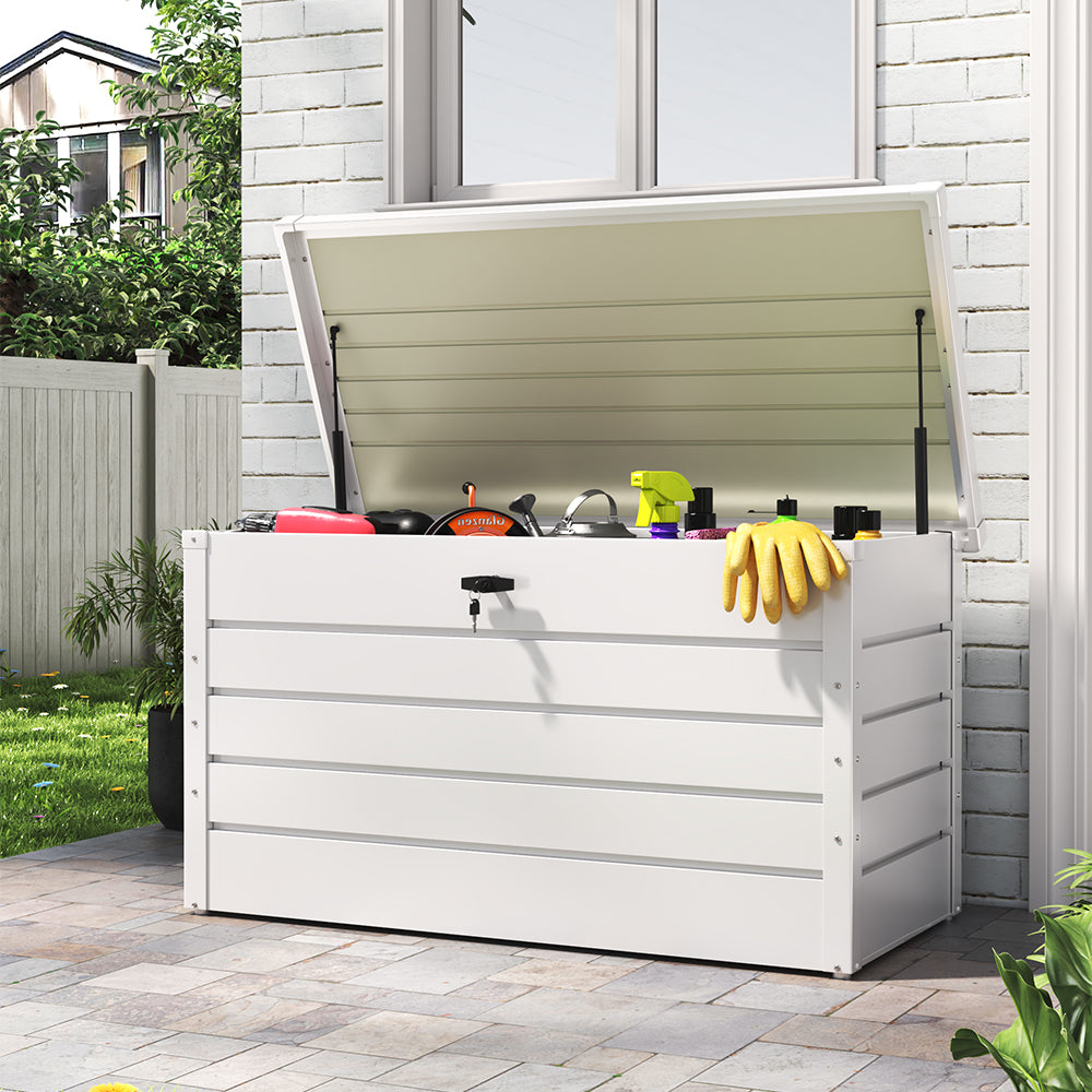 white steel garden storage box – closed and placed beside garden wall or patio bench