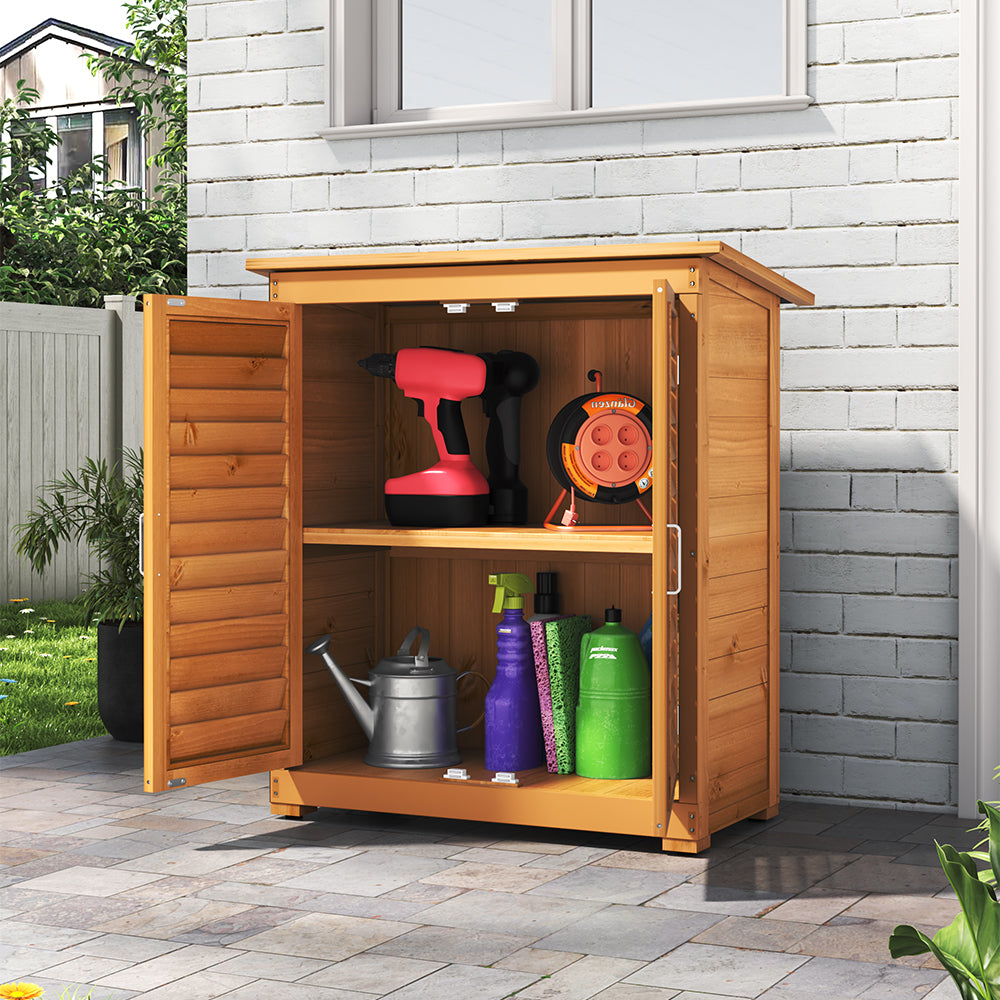 3x2ft Outdoor Wooden Tool Shed Placed Against House Wall – Doors Open Displaying Organised Garden Tools