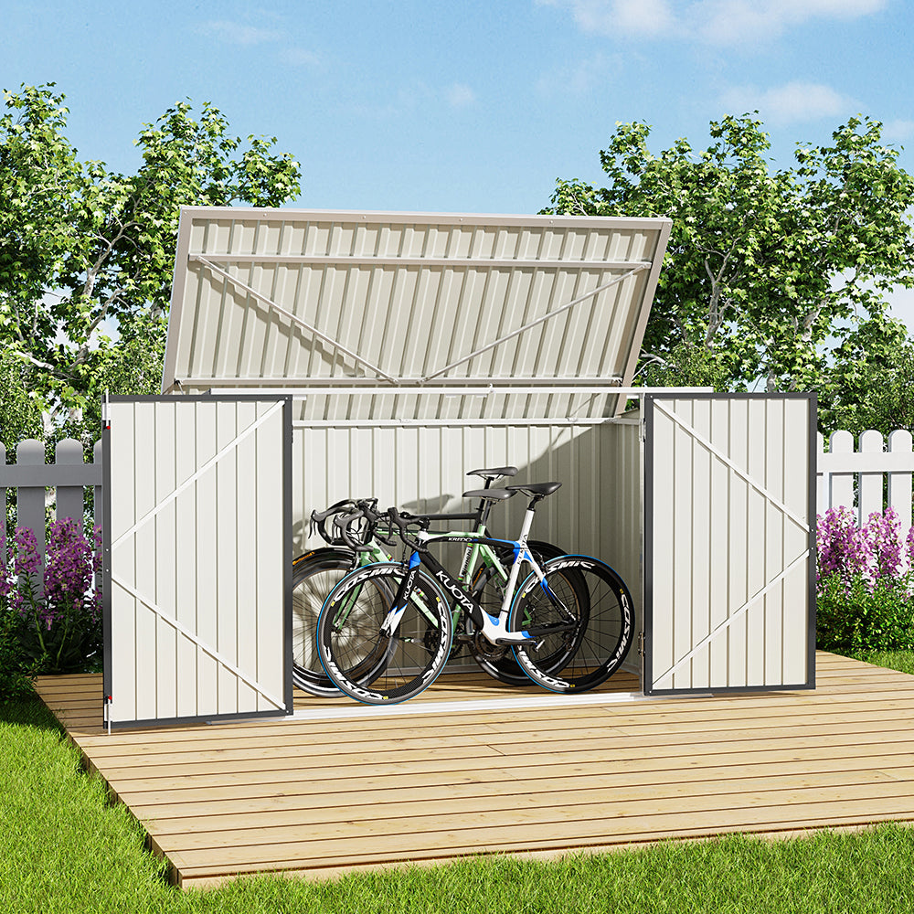 black garden shed door open with bike inside – backyard patio placement example