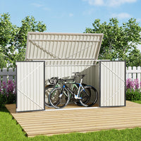 black garden shed door open with bike inside – backyard patio placement example