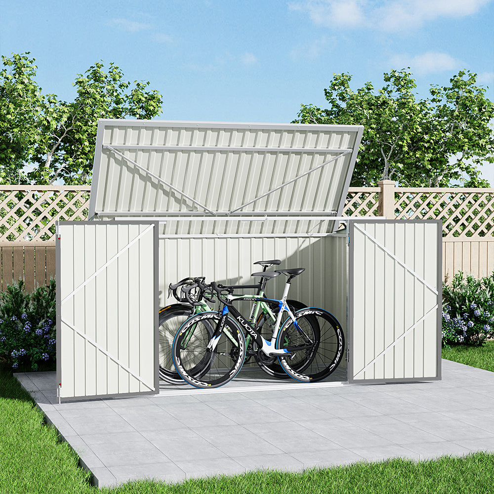 grey 7x3ft garden shed with door open, storing bikes beside patio fence