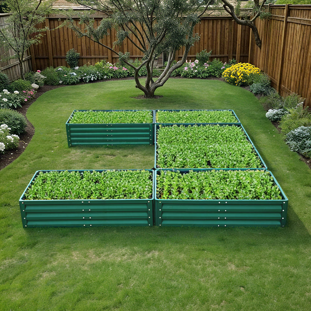 Green U-shaped Metal Raised Garden Bed placed in a vibrant garden with healthy plants