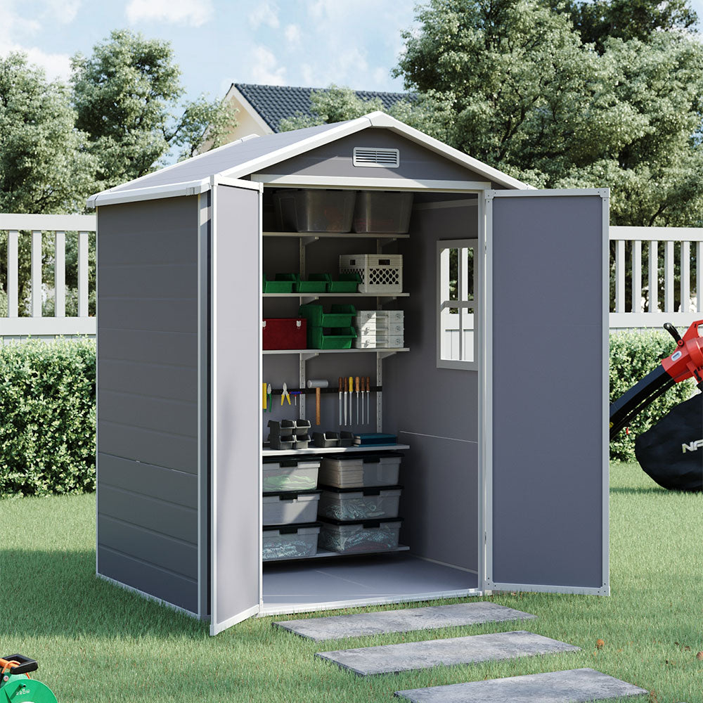 side view of 6x4ft grey garden storage shed with open door and organized tool storage inside