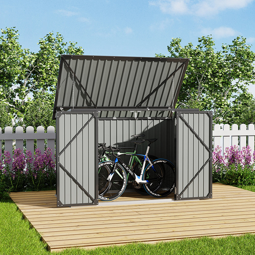 backyard scene of 7x3ft black metal shed with open double doors used for bicycle and bin storage
