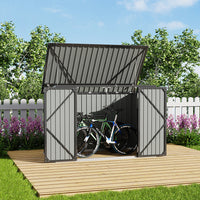 backyard scene of 7x3ft black metal shed with open double doors used for bicycle and bin storage